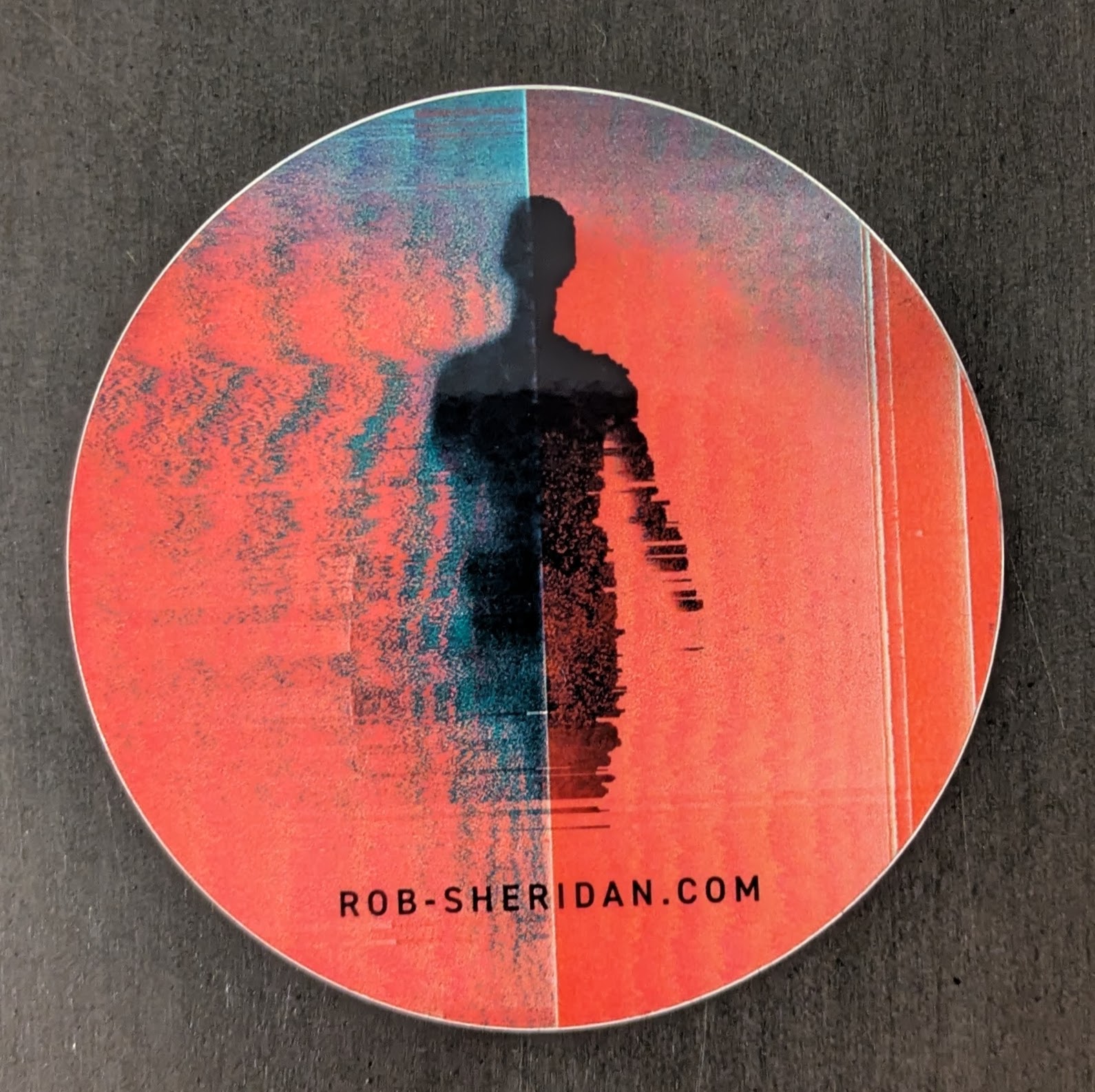 A sticker of Turbulence with a link to rob-sheridan.com