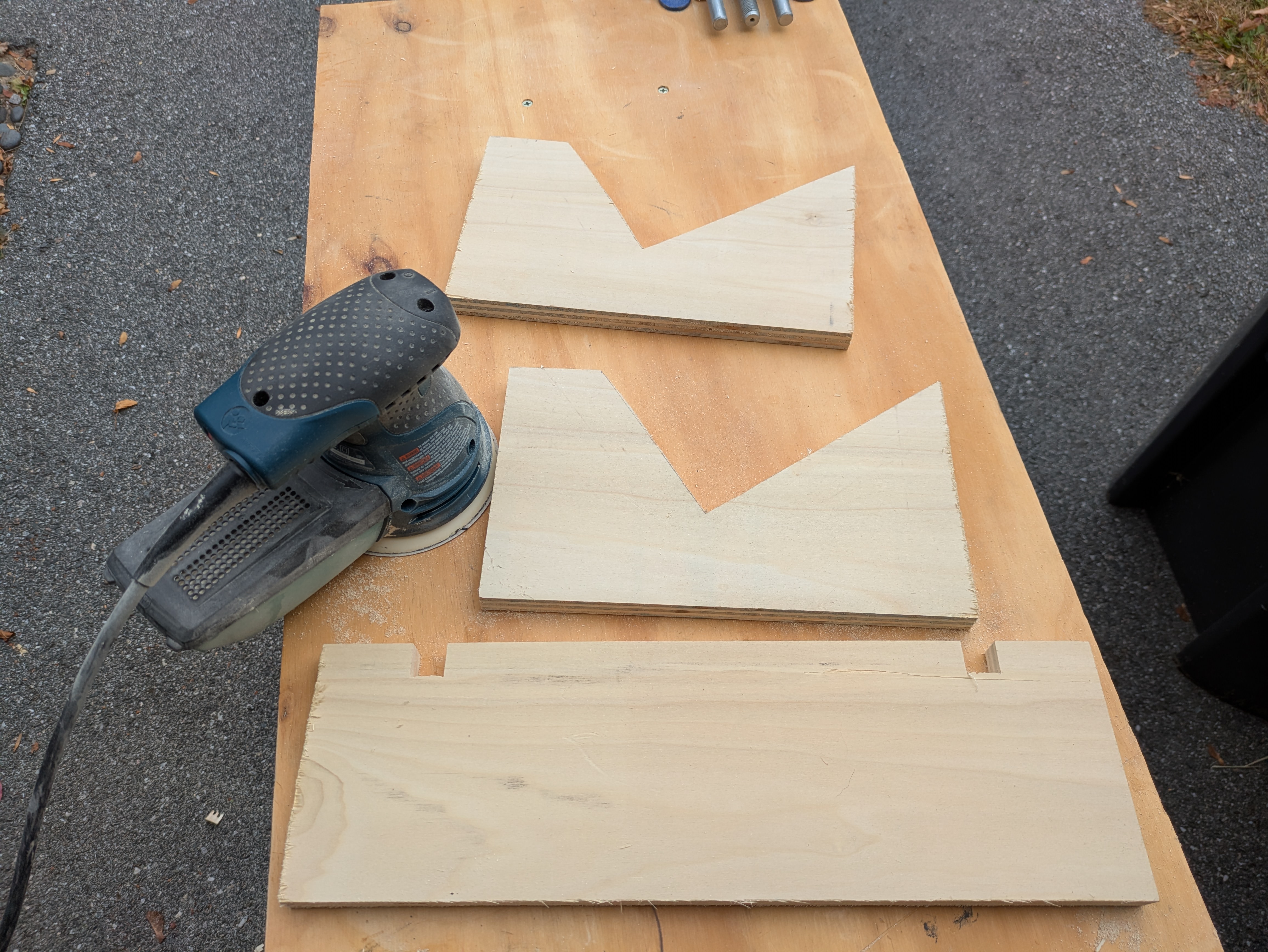 Sanding the pieces of the stand