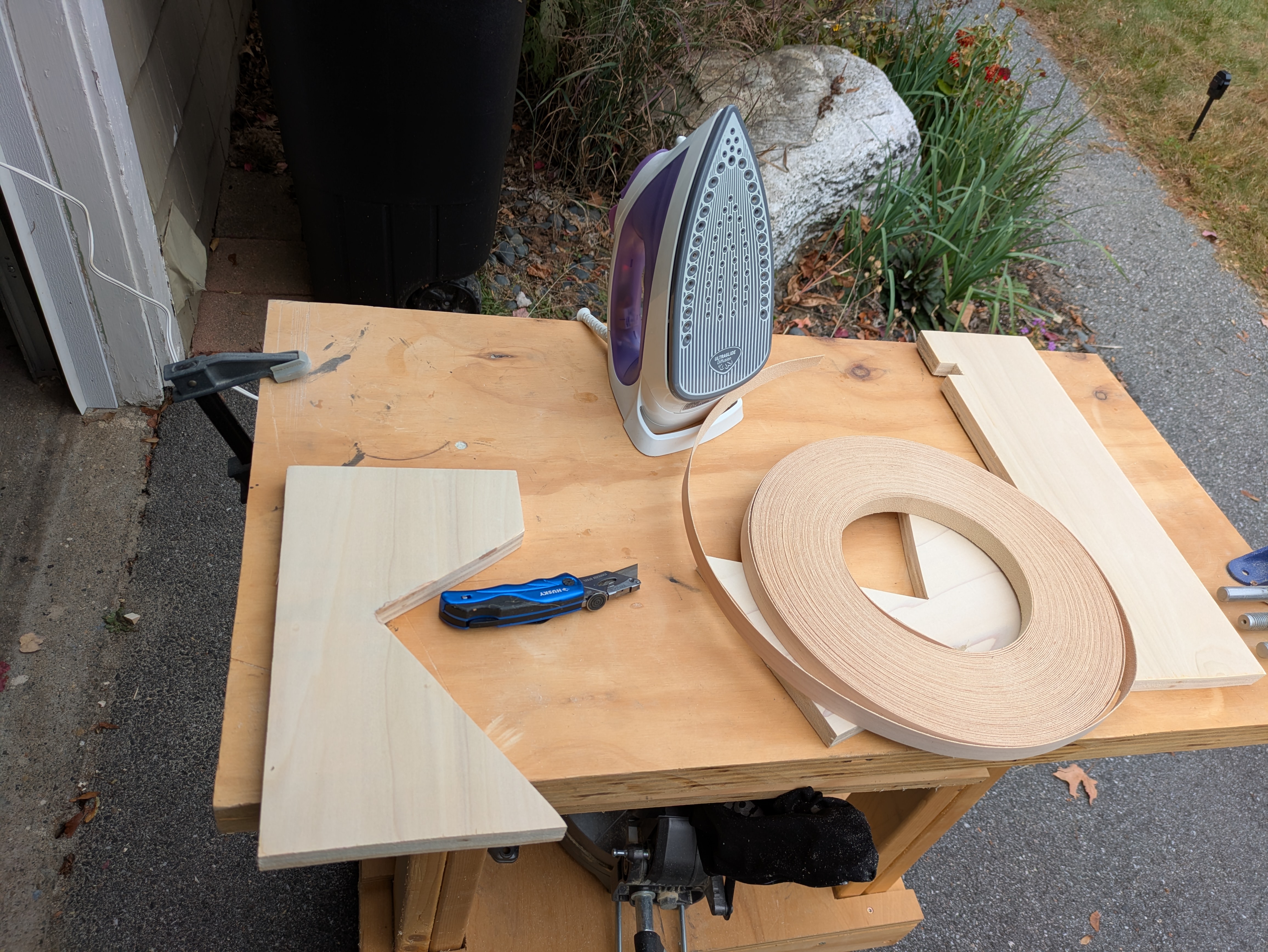 Applying edge banding to the front of the tilt-back stand