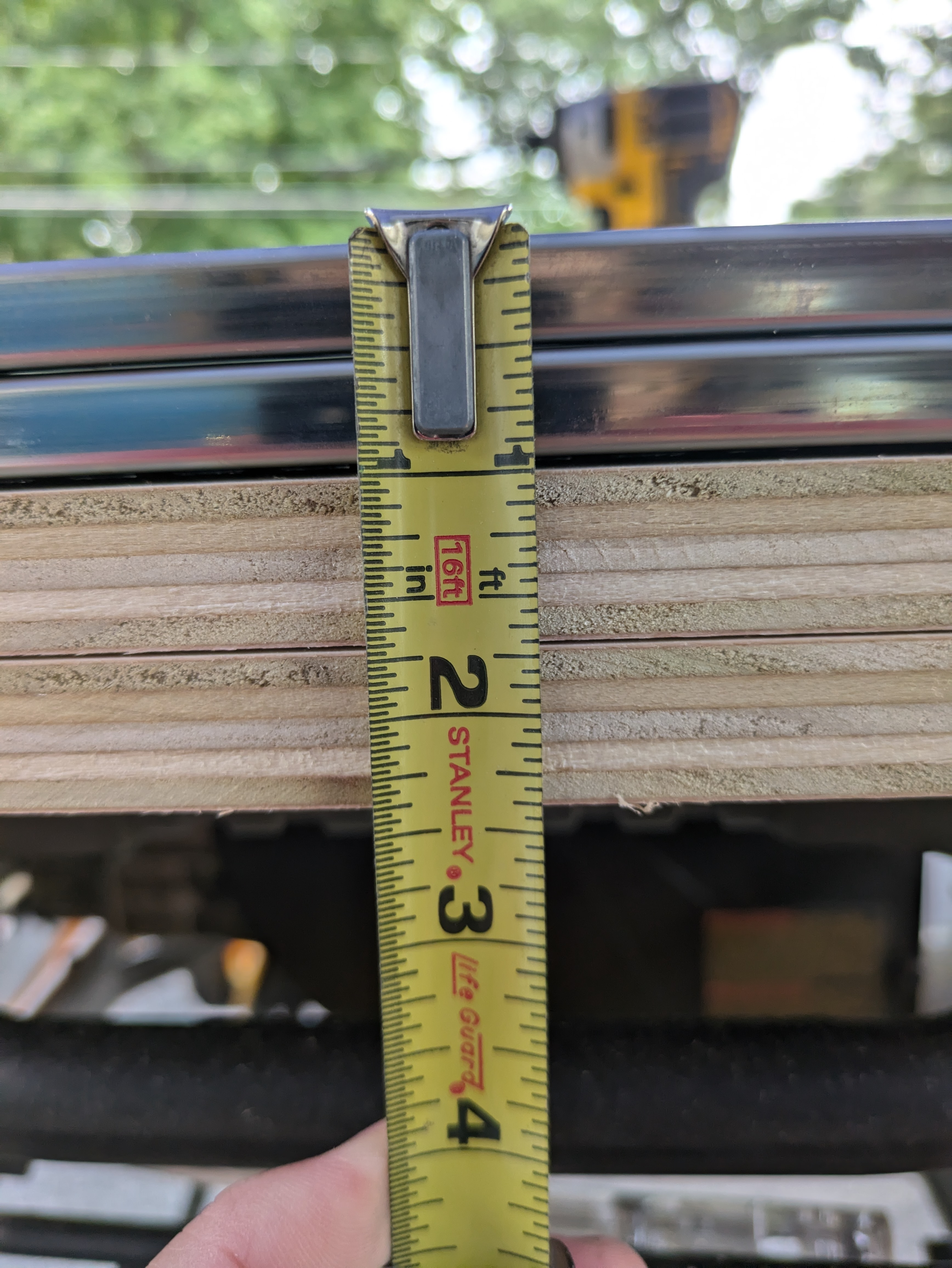 Measuring the thickness of the plywood and drawer slides