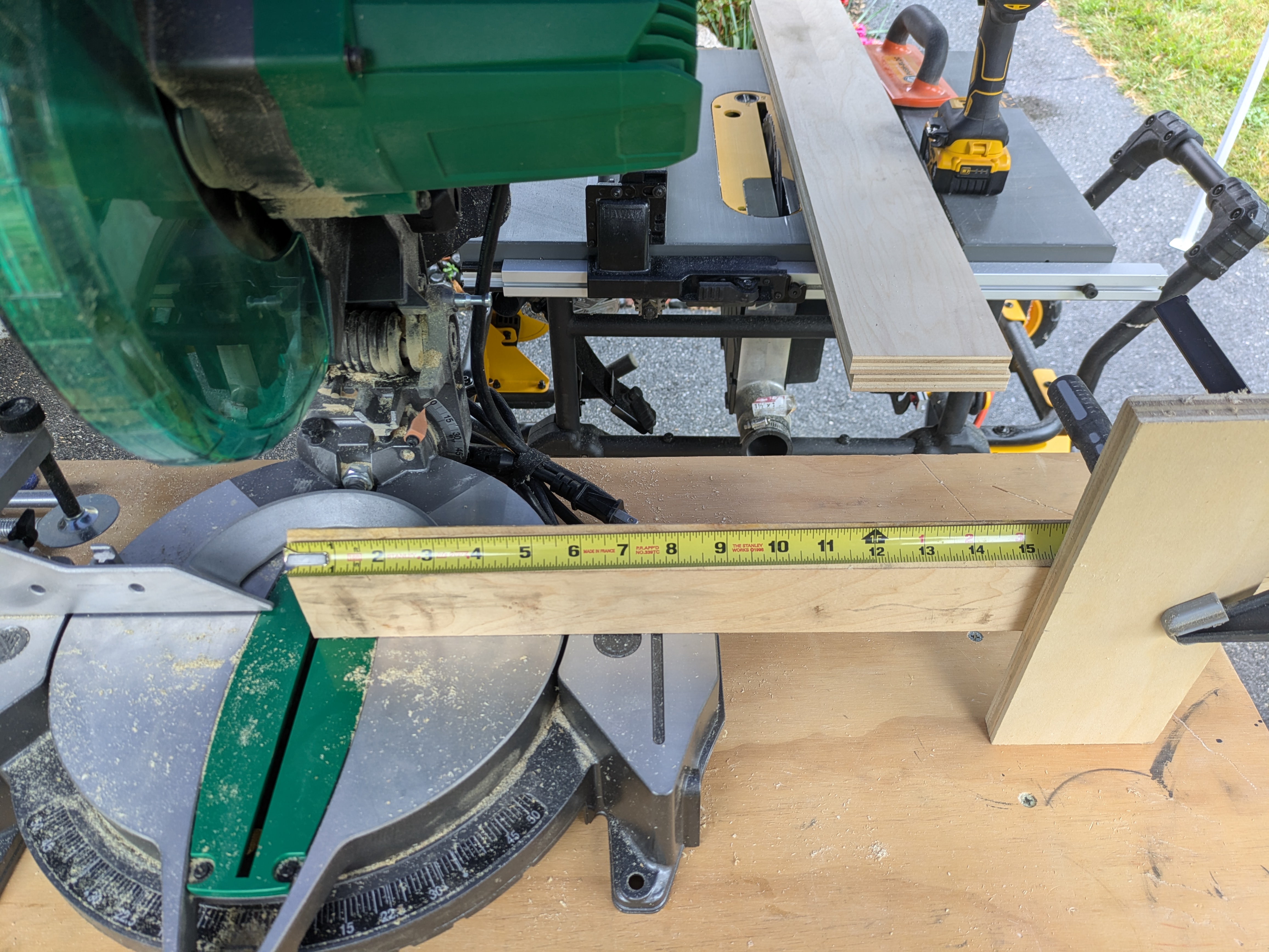 Miter saw extension fence with tape measure