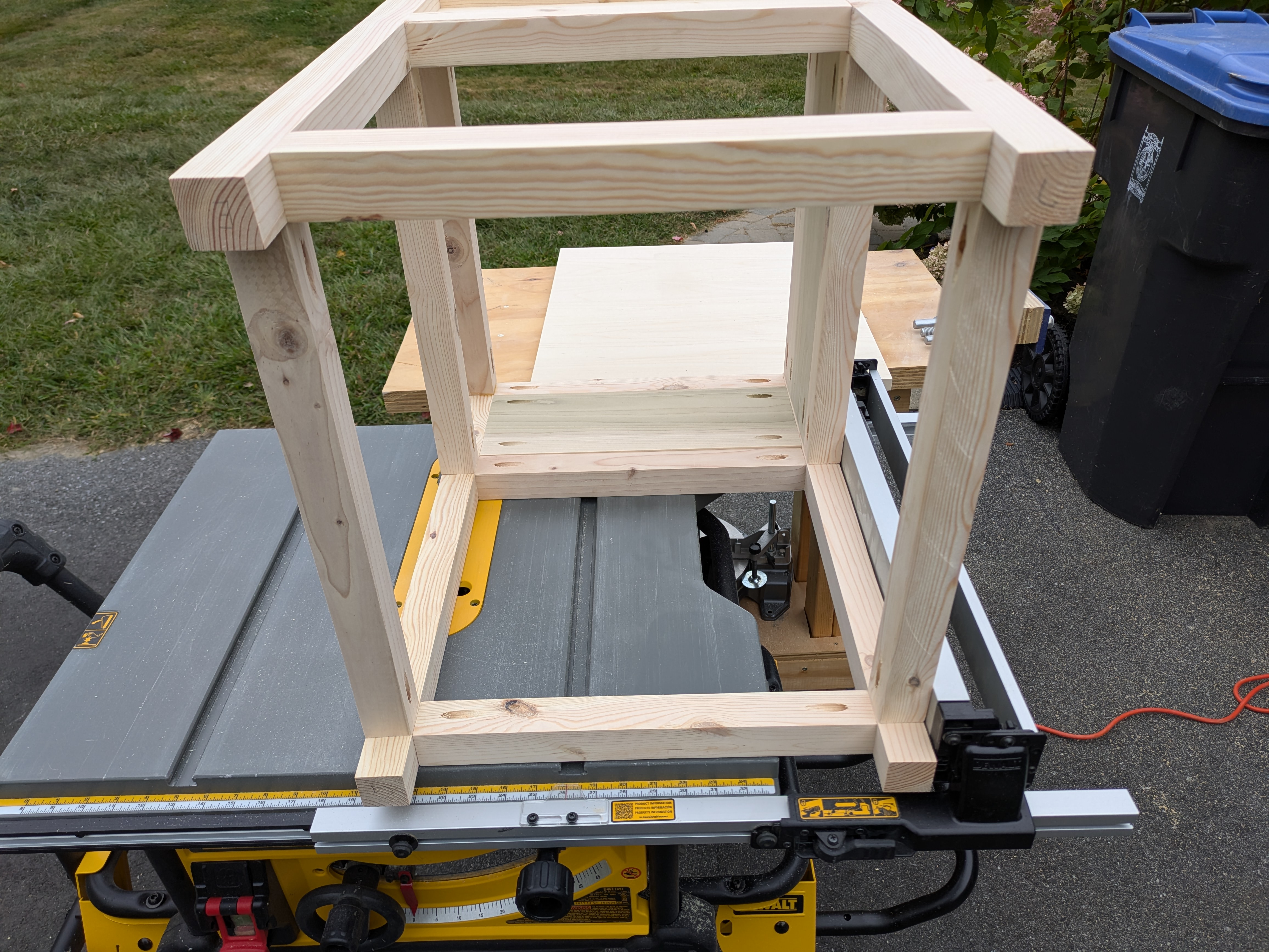 Measuring the table dimensions by laying it on top of the table saw