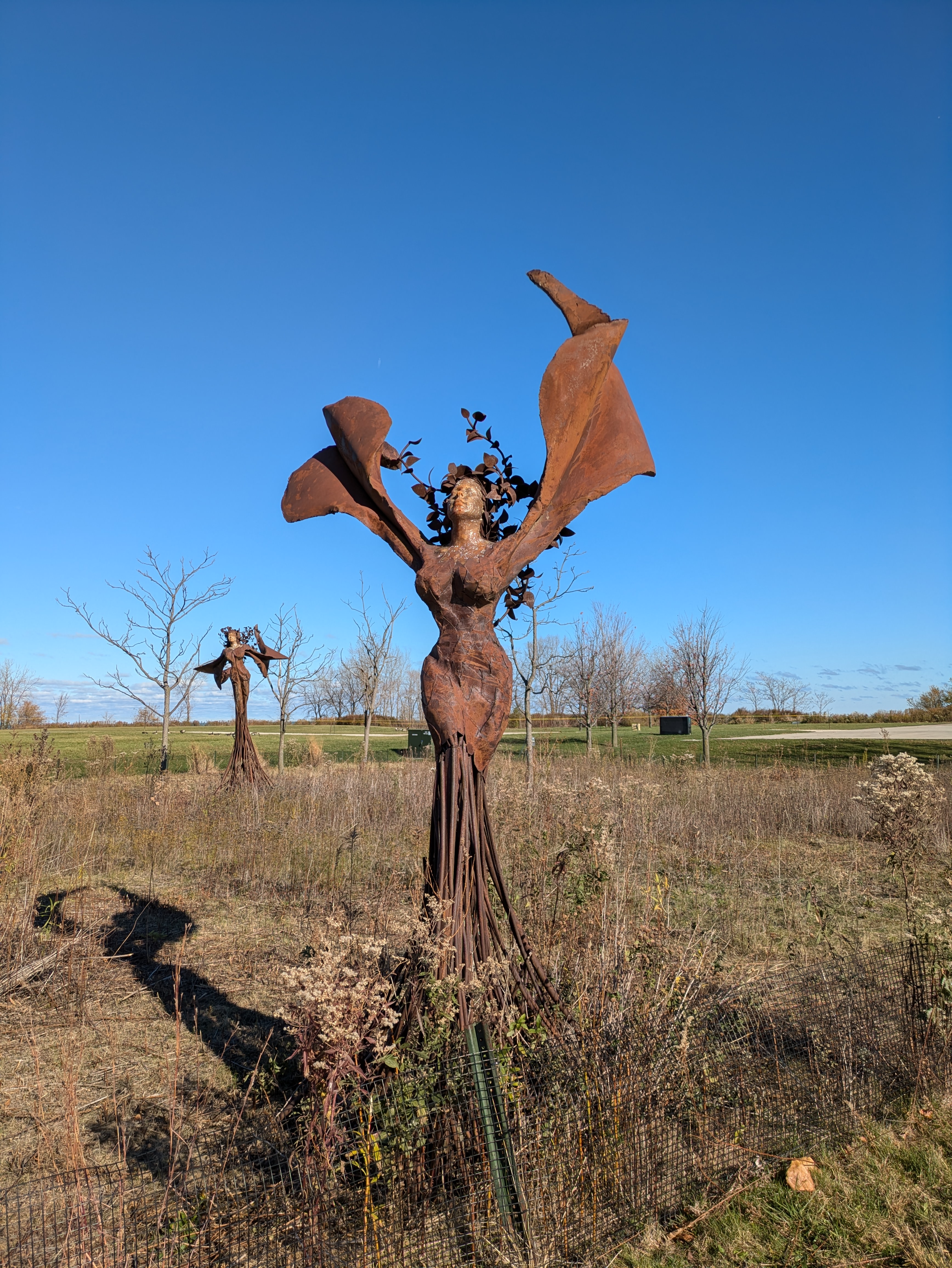 A statue of what I think are fairies in a garden. I must admit, I've seen more beautiful fairies.