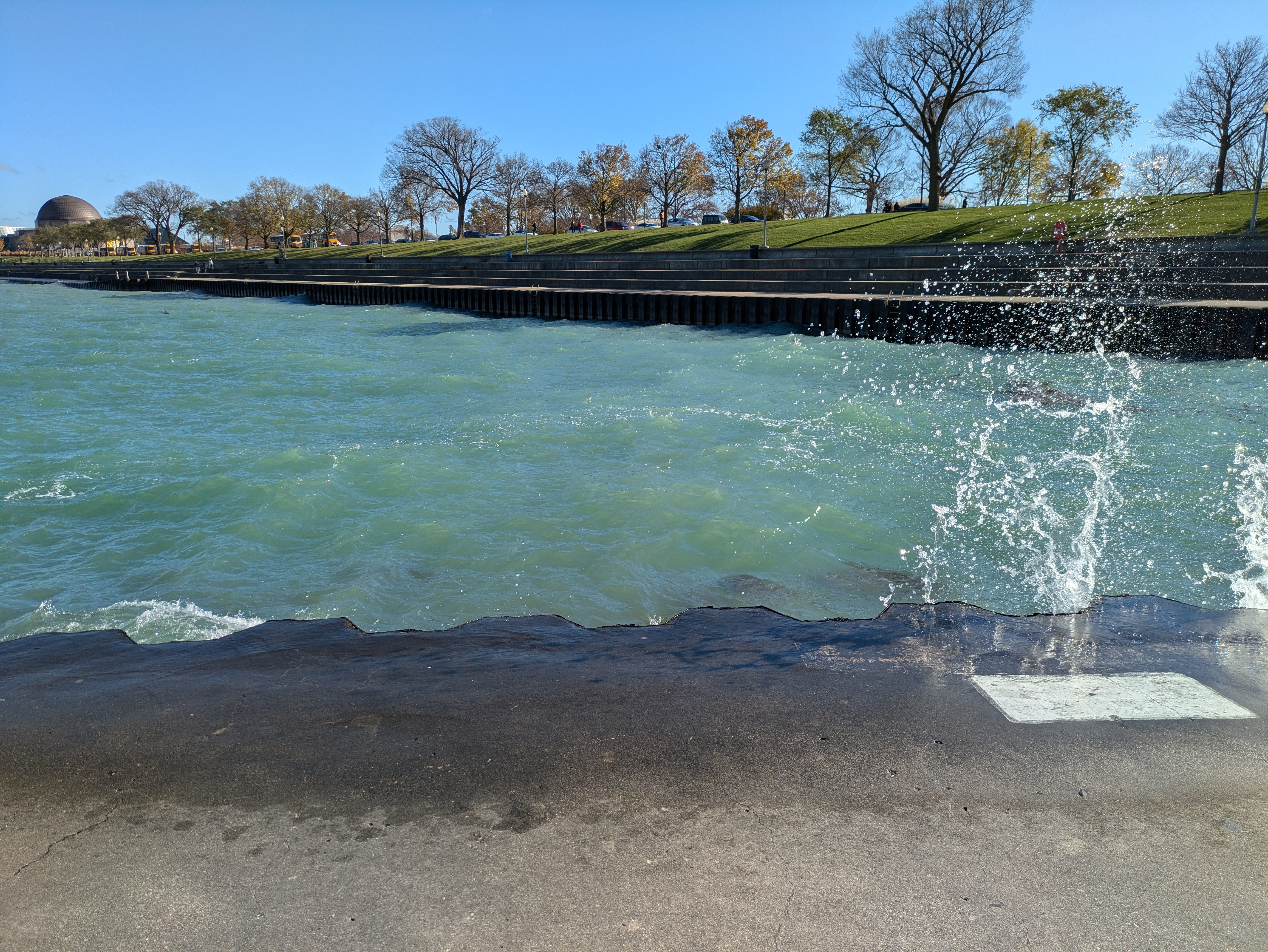 The waves from the lake splashing along the walking path